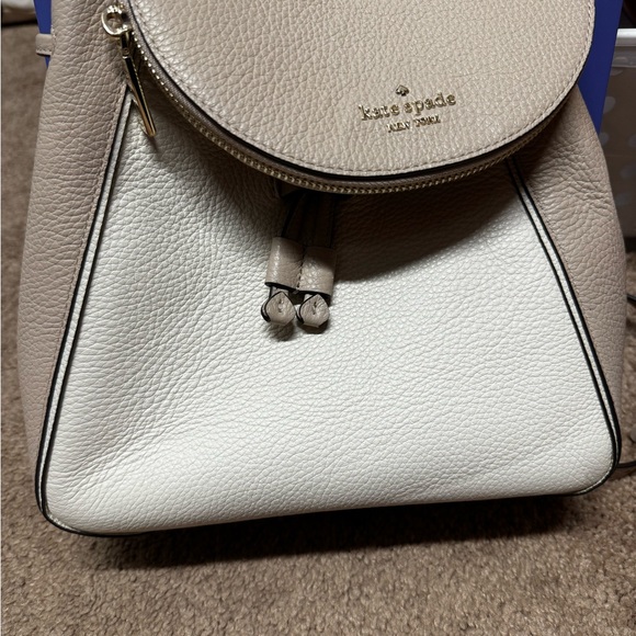 kate spade mini backpack crossbody KSNY Natalie Backpack, Pomegranate Pink Crushed Velvet Convertible Crossbody, Luxurious Small Shoulder Purse For Women Front signature emblem logo plaque with floating spade Kate Spade leather mini backpack